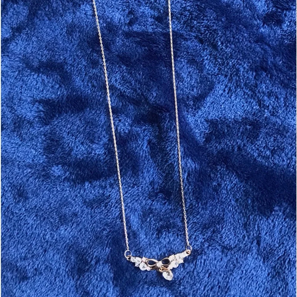 NWT Crystal Drop Gold toned Necklace with Bow Accent
